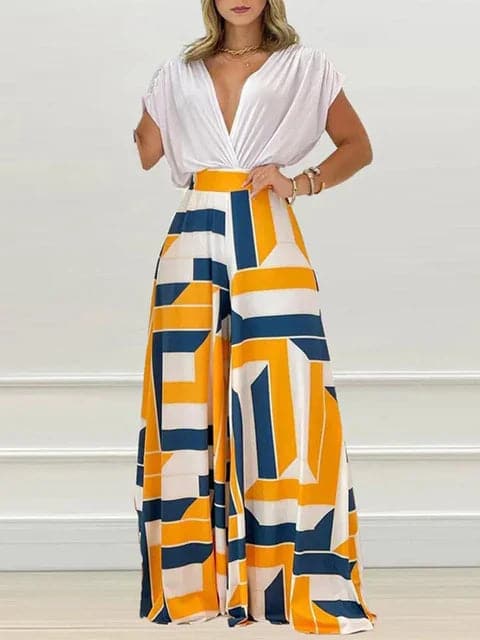 Dambyxa Jumpsuit - Djup V-ringning - Korta Ärmar - Vid Benpassform - Elegant Blommig Design