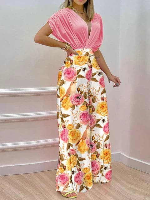 Dambyxa Jumpsuit - Djup V-ringning - Korta Ärmar - Vid Benpassform - Elegant Blommig Design