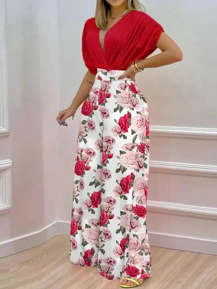 Dambyxa Jumpsuit - Djup V-ringning - Korta Ärmar - Vid Benpassform - Elegant Blommig Design