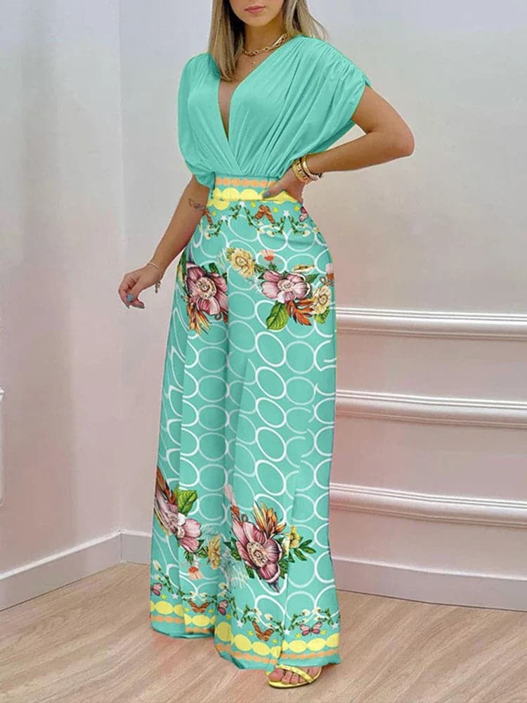 Dambyxa Jumpsuit - Djup V-ringning - Korta Ärmar - Vid Benpassform - Elegant Blommig Design