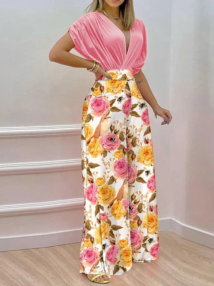 Dambyxa Jumpsuit - Djup V-ringning - Korta Ärmar - Vid Benpassform - Elegant Blommig Design