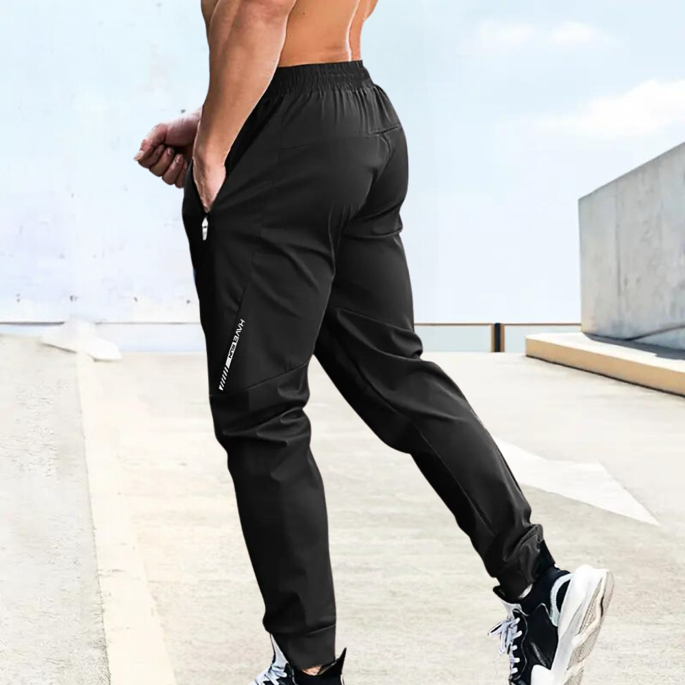 Herr Joggingbyxor - Sportig Passform - Elastisk Midja med Dragsko - Fickor med Dragkedja