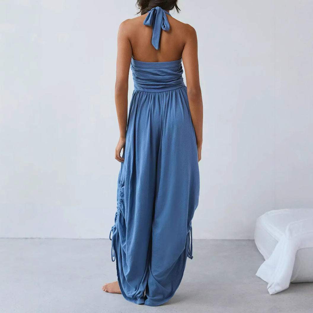 Dam jumpsuit – halterneck – draperade vida ben – rynkad överdel – justerbara sidor