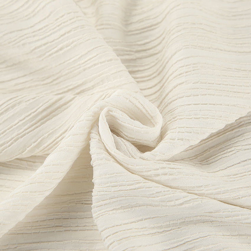 Damset med linnemix – Ärmös crop top med knytning – Vida byxor med hög midja