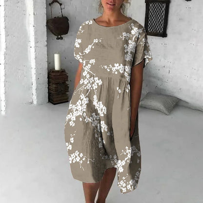 Damklänning midi – avslappnad passform – kort ärm – blommigt tryck – andningsbart tyg