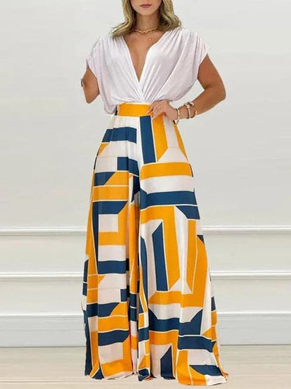 Dambyxa Jumpsuit - Djup V-ringning - Korta Ärmar - Vid Benpassform - Elegant Blommig Design
