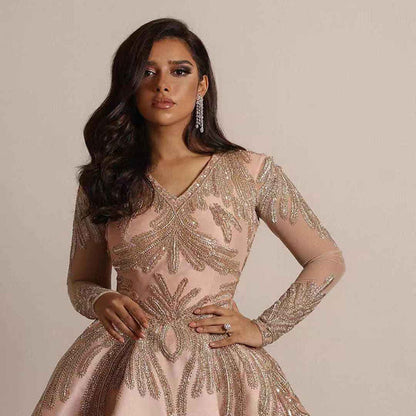 Damklänning – Djup V-ringning – Lång ärm – A-linje – Paljettprydd hel längd