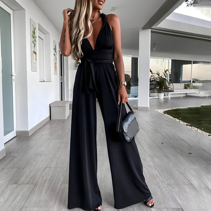 Dam Jumpsuit – Ärmös – Djup V-ringning – Vida Ben – Justerbar Midja – Luftigt Tyg