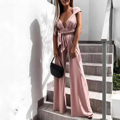 Dam Jumpsuit – Ärmös – Djup V-ringning – Vida Ben – Justerbar Midja – Luftigt Tyg