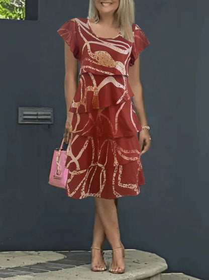 Damklänning midi – avslappnad passform – lotusärm – volangkjol – tryckt mönster