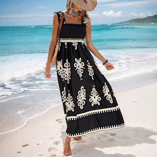 Damklänning maxi – axelbandslös omlottliv – luftig passform – tryckt mönster