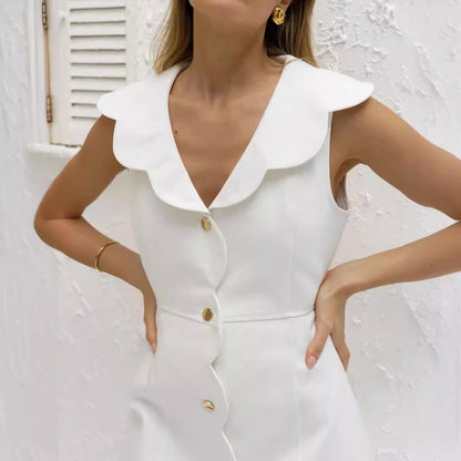 Damklänning i denim – Skräddarsydd passform – Ärm­lös – Knälång med vågig knappslå