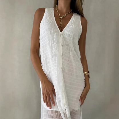 Damklänning lång – spetsmönster – ärmlös – V-ringning – slits framtill – luftig passform