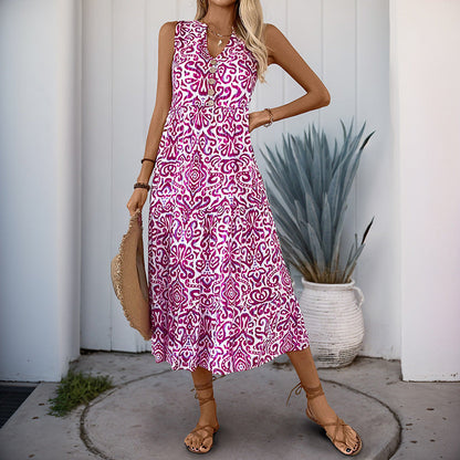 Damklänning midi – ärmlös V-ringning – avslappnad passform – abstrakt mönster – A-linjeformad