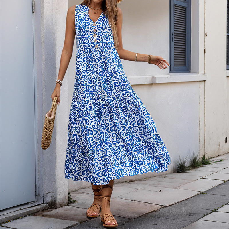 Damklänning midi – ärmlös V-ringning – avslappnad passform – abstrakt mönster – A-linjeformad