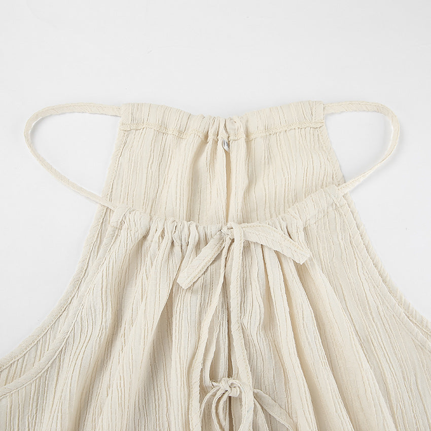 Damset med linnemix – Ärmös crop top med knytning – Vida byxor med hög midja