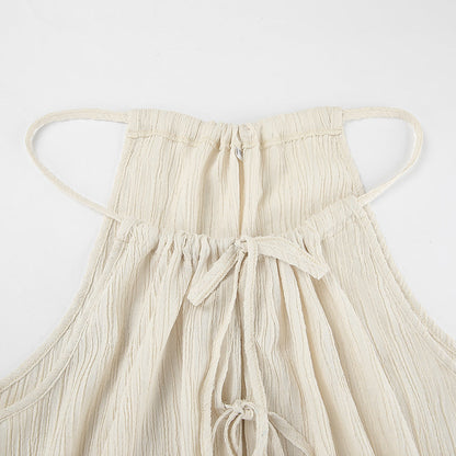 Damset med linnemix – Ärmös crop top med knytning – Vida byxor med hög midja