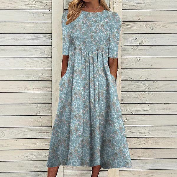 Damklänning i midimodell - Lös passform - Rund halsringning - Blommigt tryck - Ficka