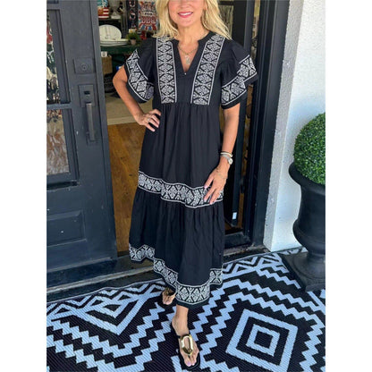 Damklänning midi – Lös passform – V-ringning – Tryckt mönster – Plisserad fåll