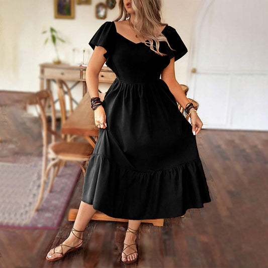 Damklänning midi – V-ringning – A-linjeformad – Kort puffärm – Volangkant