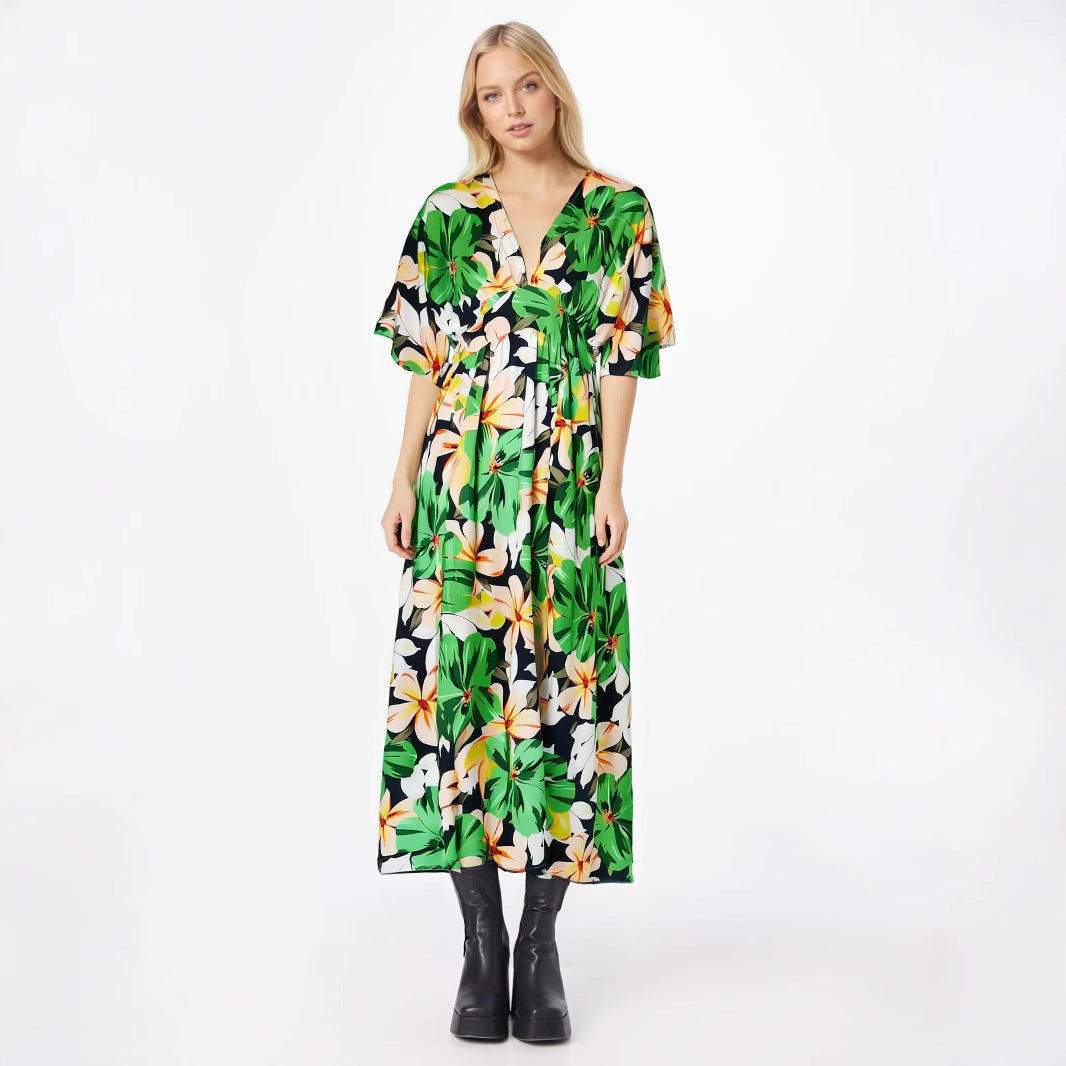 Damklänning – Hög midja – Lös passform – V-ringning – Korta vida ärmar – Hellång med slits