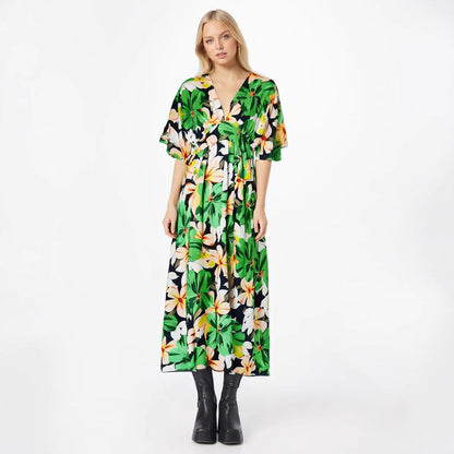 Damklänning – Hög midja – Lös passform – V-ringning – Korta vida ärmar – Hellång med slits