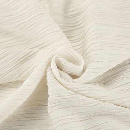 Damset med linnemix – Ärmös crop top med knytning – Vida byxor med hög midja