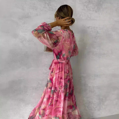 Damklänning – Maxilängd – V-ringning – Bälte i midjan – Lång ärm – Volangkjol