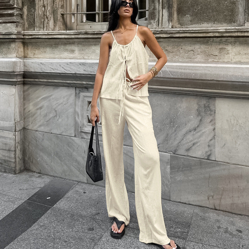 Damset med linnemix – Ärmös crop top med knytning – Vida byxor med hög midja
