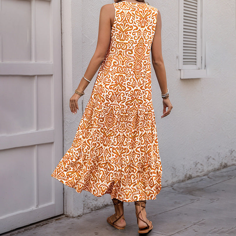 Damklänning midi – ärmlös V-ringning – avslappnad passform – abstrakt mönster – A-linjeformad