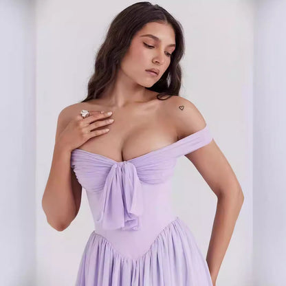 Damklänning – Off shoulder – Figurnära liv – Utställd kjol – Rosett framtill – Lätt tyg