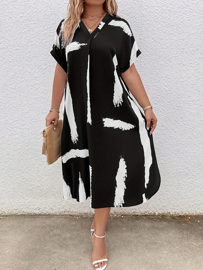 Damklänning - V-ringad Midi - Lös Passform - Kort Ärmslut - Modern Mönstrad Design