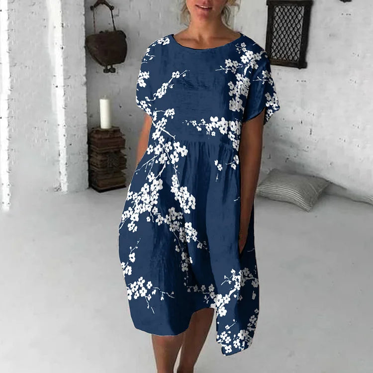 Damklänning midi – avslappnad passform – kort ärm – blommigt tryck – andningsbart tyg