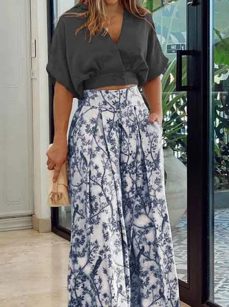 Damset i två delar – Avslappnad topp med dolmanärmar – Vida byxor med hög midja – Andningsbart tyg