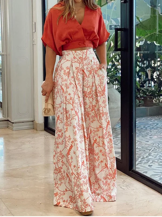 Damset i två delar – Avslappnad topp med dolmanärmar – Vida byxor med hög midja – Andningsbart tyg