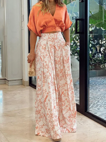 Damset i två delar – Avslappnad topp med dolmanärmar – Vida byxor med hög midja – Andningsbart tyg