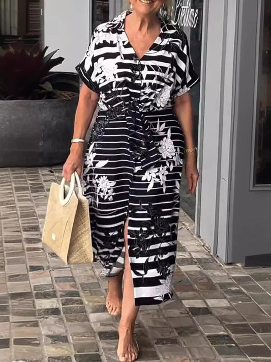 Damklänning – Kort ärm – Knäppning – Växtmönster – Midjebälte – Slits – Midi