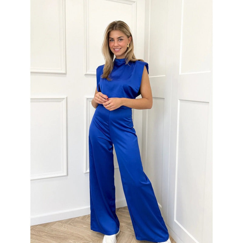 Dam jumpsuit – Satinfinish – Ärmös – Hög hals – Öppen rygg – Vida ben – Elegant passform