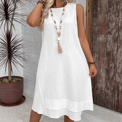 Damklänning midi – Ärmös – Avslappnad passform – Crinklad textur – Lagerad fåll