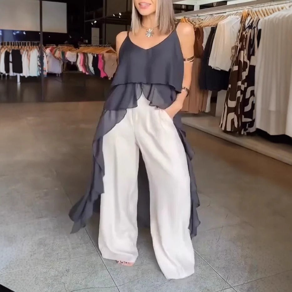 Damklänning – V-ringning – Spagettiband – Volanglager – Asymmetrisk fåll – Lös passform