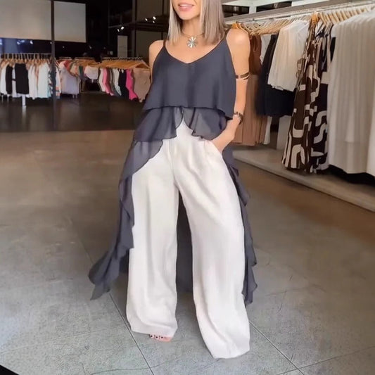 Damklänning – V-ringning – Spagettiband – Volanglager – Asymmetrisk fåll – Lös passform