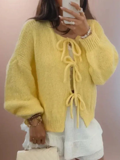 Damkofta – Oversizepassform – Ballongärmar – Boho knytning – Ullstickad