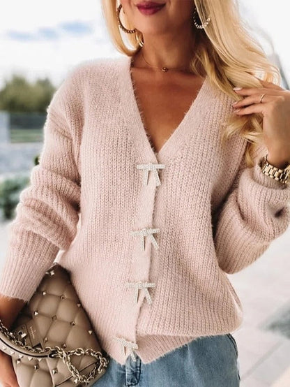 Damstickad topp – Avslappnad passform – Mjuk ullkänsla – V-ringning – Banddetaljer